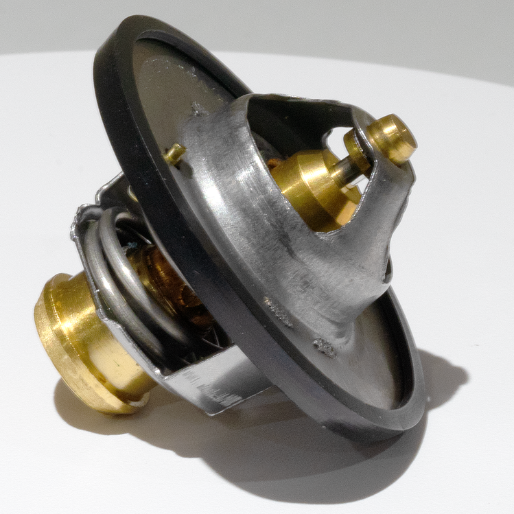 Side view of the 180-Degree Thermostat for RAM 6.4L engines, showcasing precision craftsmanship